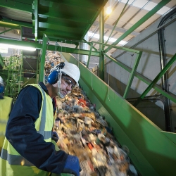 Worker in recycling plant