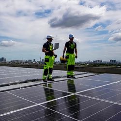 Two workers and solar panels