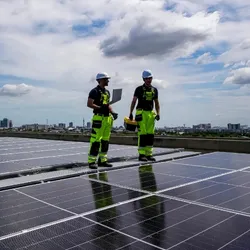 Two workers and solar panels